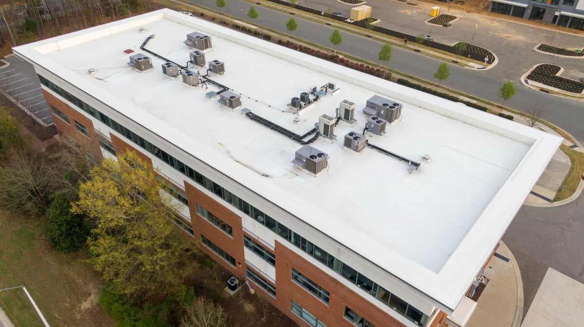 Aerial view of a modern white flat roof membrane